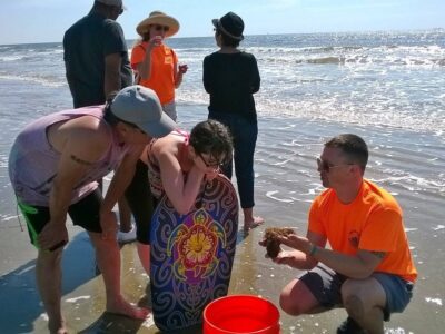 Bucket Brigade tour guide educating visitors about marine life