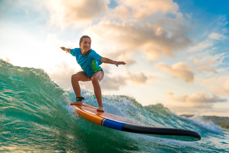 Young girl surfing