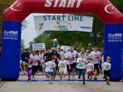 Participants running in the YMCA Run Thru The Woods event